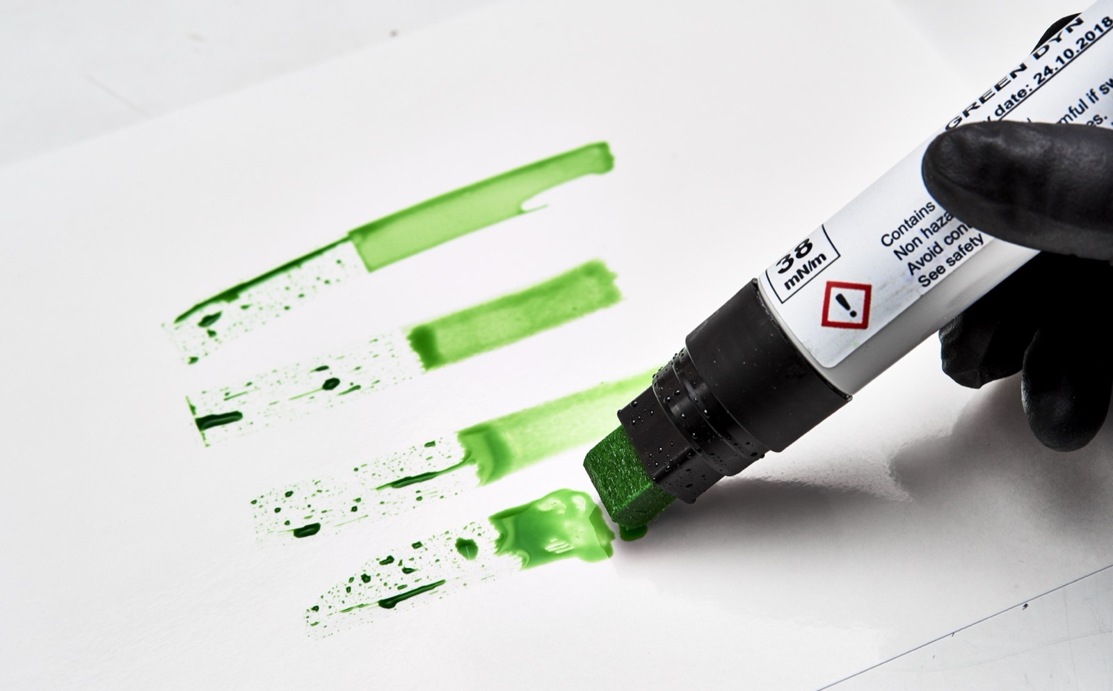 Dyne test being performed on a treated film sample